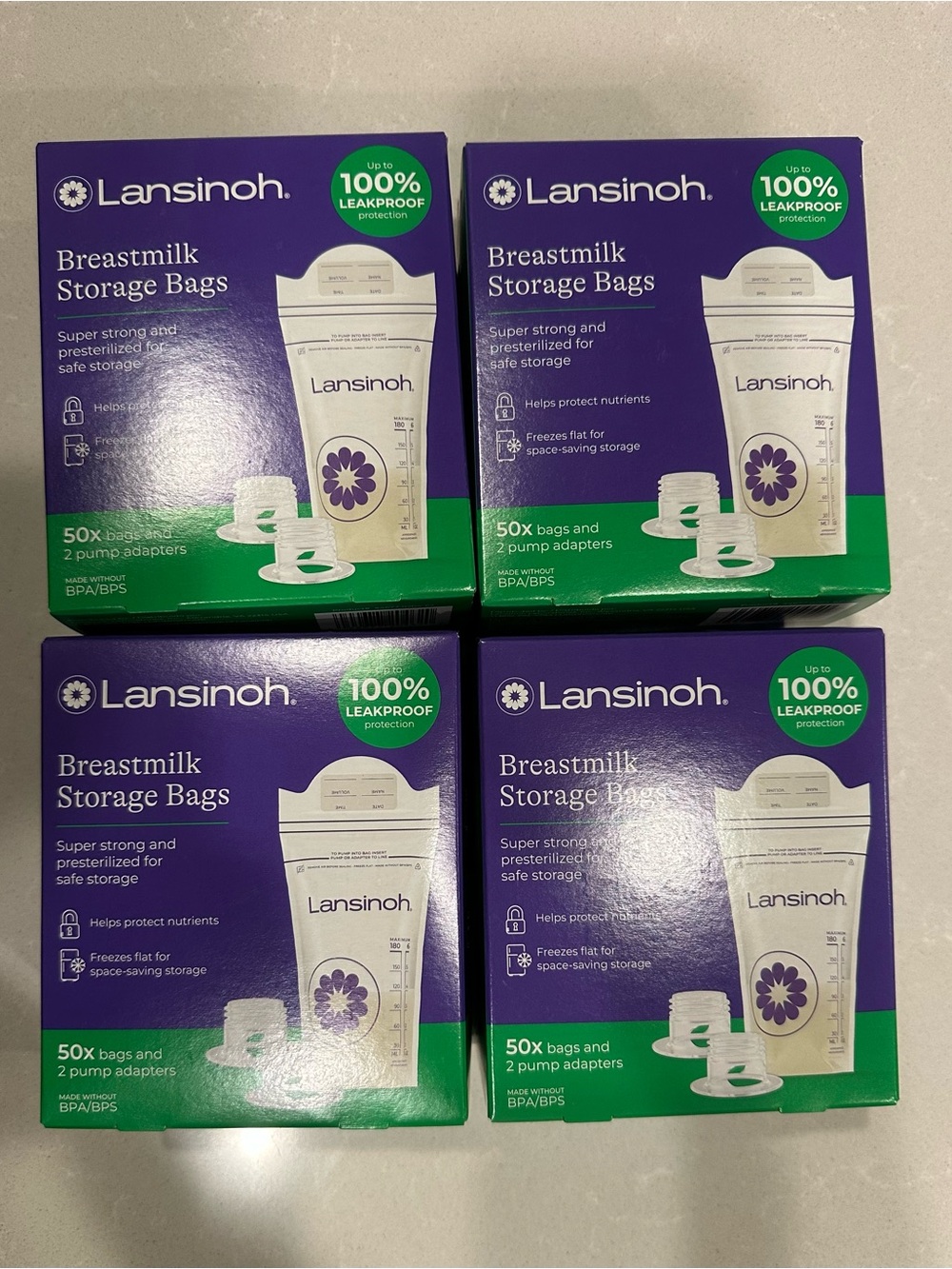 Unopened Lansinoh Breastmilk Storage Bags and pump adapters - 200 bags total